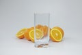 Empty glass and halves of oranges Royalty Free Stock Photo