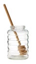 Empty glass honey jar with dipper isolated.