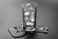 Empty glass with ice cubes isolate on grey background Royalty Free Stock Photo