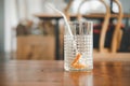 Empty glass of ice and slice orange after drink at cafe Royalty Free Stock Photo