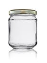 Empty glass jar closed by a metal cover with reflection, isolated on a white background Royalty Free Stock Photo