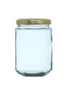 Empty glass jar with a metal lid. Isolated on a white background Royalty Free Stock Photo