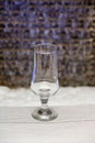 Empty glass for juice, water or ice cream on a wooden table
