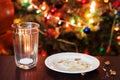 empty glass from milk and crumbs from cookies for Santa Claus un Royalty Free Stock Photo