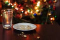 empty glass from milk and crumbs from cookies for Santa Claus un Royalty Free Stock Photo