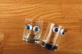 Empty glass shot plastic eyes