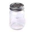 Empty glass spice jar isolated on a white background. Cooking utensil. Kitchen ware. Kitchen utensils. A jar for spice Royalty Free Stock Photo