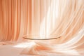 Empty glass table for montage your products on beautiful peach fuzz background with draped textile Royalty Free Stock Photo