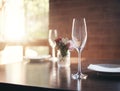 Empty glass on table for wine, champagne or alcohol at dinner in romantic restaurant, home or diner. Luxury, lunch or Royalty Free Stock Photo