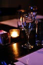 Empty glass of wine in chic restaurant dining room