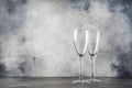 Empty glasses for champagne or sparkling wine, gray background, copy space, selective focus Royalty Free Stock Photo