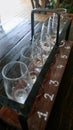 Empty glasses with different sorts of craft beer on wooden bar. Royalty Free Stock Photo