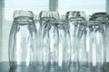 Empty glasses on grey table against blurred background Royalty Free Stock Photo