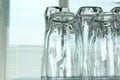 Empty glasses on grey table against blurred background. Space for text Royalty Free Stock Photo