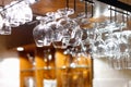 Empty glasses hanging above the bar in the restaurant Royalty Free Stock Photo