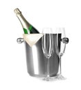 Empty glasses and metal bucket with bottle of champagne on white Royalty Free Stock Photo