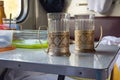 Empty glasses in metal cup holders stand on a table in a train compartment Royalty Free Stock Photo