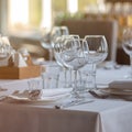 Empty glasses in restaurant background. Table set for an event party or wedding reception. Royalty Free Stock Photo
