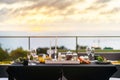 Empty glasses set in restaurant - Dinner table outdoors at sunset Royalty Free Stock Photo