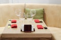 Empty glasses on small wooden table, red napkins Royalty Free Stock Photo