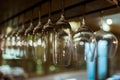 Empty glasses for wine above a bar rack Royalty Free Stock Photo