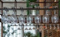 Empty glasses for wine above a bar rack in restaurant Royalty Free Stock Photo