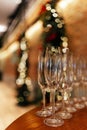 Empty glasses for wine, champagne are on the New Year`s table in a loft restaurant