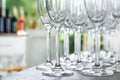 Empty glasses on wooden table against background, closeup view Royalty Free Stock Photo