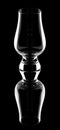 Empty glencairn whisky glass with reflection isolated on a black background