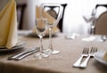 Empty goblets and other cutlery are served on the festive table Royalty Free Stock Photo