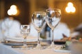 empty goblets and other cutlery are served on the festive table Royalty Free Stock Photo