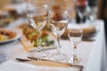 empty goblets and other cutlery are served on the festive table Royalty Free Stock Photo