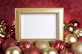 Empty Gold Frame with Christmas Ornaments on a Red Background Royalty Free Stock Photo
