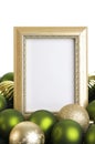 Empty Gold Frame with Christmas Ornaments on a white Background Royalty Free Stock Photo