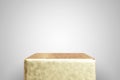 Empty gold podium on white background. Best for product presentation. 3d rendered cube pedestal
