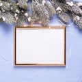 Empty golden frame and Christmas decorations on blue textured b Royalty Free Stock Photo