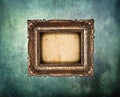 Empty golden frame on grunge light blue wall Royalty Free Stock Photo