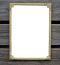 Empty golden picture frame on wooden wall Royalty Free Stock Photo