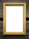 Empty golden picture frame on wooden wall Royalty Free Stock Photo