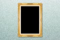 Empty golden vintage frame on wallpaper Royalty Free Stock Photo