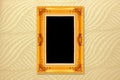 Empty golden vintage frame on wallpaper Royalty Free Stock Photo