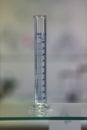 Empty graduated cylinder into chemistry laboratory Royalty Free Stock Photo