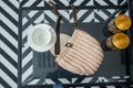 Empty gray knitted purse and empty cups is on glass table. Ad and buy concept. Top view