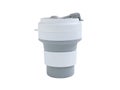 Empty Gray-white foldable silicone mug for hot and cold drinks.