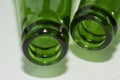 Empty green beer bottle necks