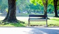 Empty green bench is placed on public park Royalty Free Stock Photo