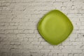 Empty green ceramic dish plate, on gray background. Top view with copy space. Royalty Free Stock Photo