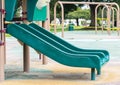 Empty green plastic slide at a closed playground Royalty Free Stock Photo