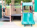 Empty green plastic slide at a closed playground Royalty Free Stock Photo