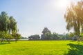 Empty green field with ancient architecture in background Royalty Free Stock Photo